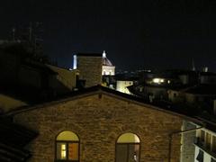 Night view of the building next to the Torre dei Consorti, with the Duomo and Orsanmichele