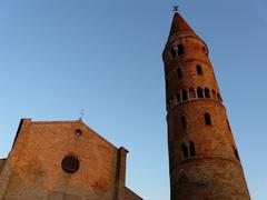 Duomo di Caorle against a bright blue sky