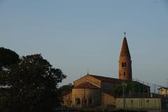 Caorle Cathedral with bell tower at sunrise