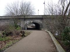 Kew Bridge viewed from the riverbank on a sunny day