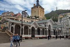 Karlovy Vary Tržní Colonnade and Zámecká Tower in April 2019