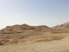 Temple of Al-Deir Al-Bahari against rocky cliffs