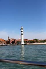 Scenic view of Venice's Grand Canal with historic buildings lining the water and boats navigating through.