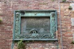 Entrance of Fortezza Medicea in Siena with a 1929 commemorative plaque