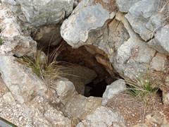 Sinkhole beside the road with railing