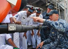 U.S. Navy Senior Chief showing mine neutralization vehicle to Bangladesh navy sailors during CARAT 2011