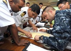 U.S. Navy Lt. Charles Cooper and Bangladesh Navy Lt. Cmdr. Ashraf Zaman planning CARAT 2012 sea phase aboard USS Decatur