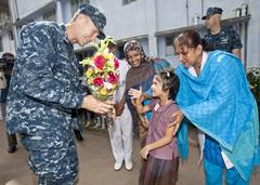 U.S. Navy Capt. Wallace G. Lovely meets with a student from the BN Ashar Alo School during CARAT 2012 in Chittagong, Bangladesh