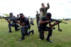 U.S. Navy Electrician’s Technician 1st Class Anthony Nekervis training Bangladeshi sailors in weapons handling during CARAT 2013