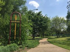 Scenic view of Benton Park in St. Louis, Missouri, featuring lush greenery and a central pond