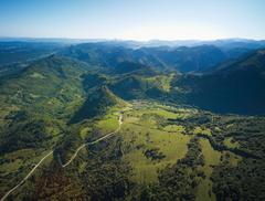 Aerial view of Montségur in Pays d'Olmes, featuring the pog and surrounding landscapes