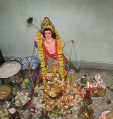 Kartik Puja in West Bengal with offerings including toys, sweets, flowers, and ritualistic materials