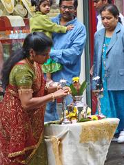 Ganesh Chaturthi procession in Paris with devotees smashing coconuts