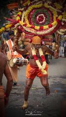 Man carrying a decorated kavadi at a festival