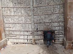 Boy entering gate to Khusru Bagh Park in Allahabad