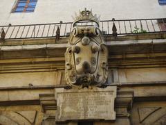 Loggia dei Banchi with Medici coat of arms and inscription of Ferdinando I de' Medici