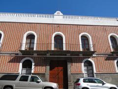 Casona with PRI emblem in downtown Puebla