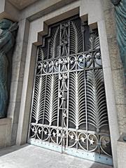 Iron gate to fallen war memorial mausoleum in Egyptian style by architects Alfonso and Camillo Guerra