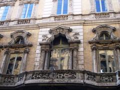 Facade of Palazzo Doria-Pamphilij with balcony in Rome on Via del Corso