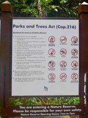 Info board with rules at Bukit Timah Nature Reserve, Singapore