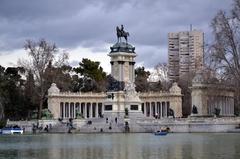 Aerial view of a park with a monument and lake