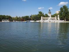 Main pond of Retiro Park with the Monument to Alfonso XII in the background