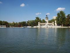 Main pond of Retiro Park with Monument to Alfonso XII in the background, Madrid, Spain