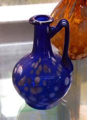 blue glass bottle with lattimo spots, ancient Roman glassware