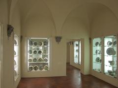 Museo Statale d'Arte Medievale e Moderna exhibition hall with ceramics