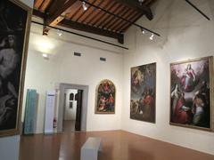 Italian museum exhibit room with framed paintings and sculptures