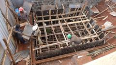 Building site in Nairobi with three workers