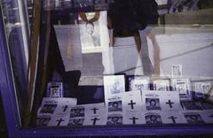 Mourning shop window display with portrait and cross for politician Josiah Mwangi Kariuki