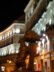 Bear and the Madrono Tree heraldic symbol of Madrid Espana at night