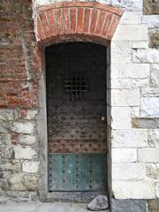 Door under the staircase of Palazzo Pretorio