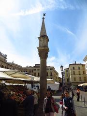 panoramic view of Piazza della Frutta with market stalls and historic architecture