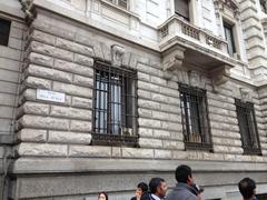 external air conditioning units on windows of a building in central Milan