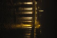 Verona at night with Christmas lights, Adige River, and Duomo tower