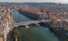 Adige River flowing through Verona, Italy with Ponte della Vittoria bridge