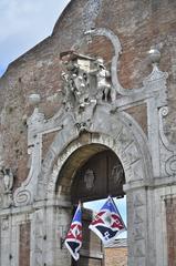 Street view with a small entrance door in Siena, Italy