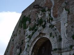 Facade details of Porta Camollia in Siena