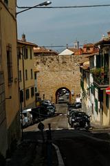 View of Porta San Miniato with Giotto's Bell Tower in the background from Via del Monte alle Croci in Florence