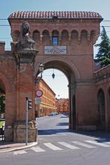 View of Saragozza Street houses through the namesake gate in Bologna