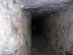 Verruca tunnel with stone walls and arched ceiling