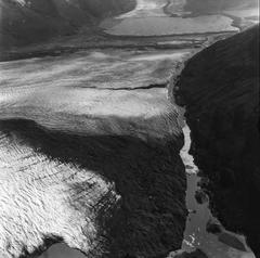 Knik Glacier terminus with calving debris and Colony Glacier in the background, 1974