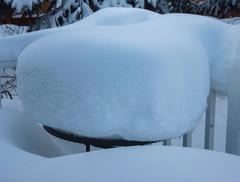 Table covered in a heavy load of snow during winter in Anchorage, Alaska