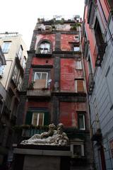 Semisdraiato sculpture in the historic center of Naples, Italy