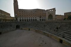 Roman Theatre of Lecce with historic ruins and modern buildings in the background