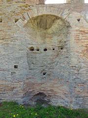 Rear facade of the Imperial building at Terme Taurine with a niche fountain in Civitavecchia, Italy