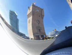 Reflection of a tower on the chrome surface of a Harley Davidson motorcycle