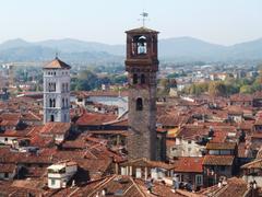 View of Torre delle Ore from Torre Guinigi in Lucca, Tuscany, Italy